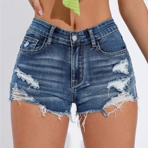 Ripped medium wash denim shorts